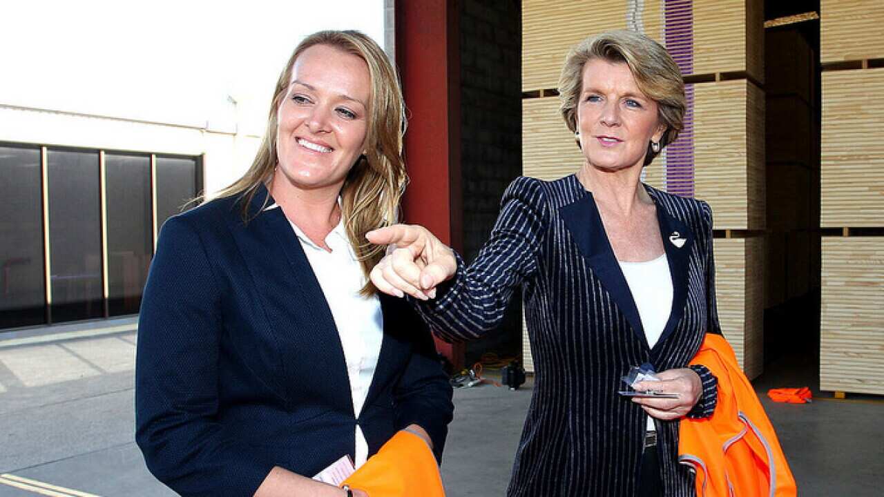Deputy Liberal Leader Julie Bishop (R) walks with Liberal candidate Fiona Scott