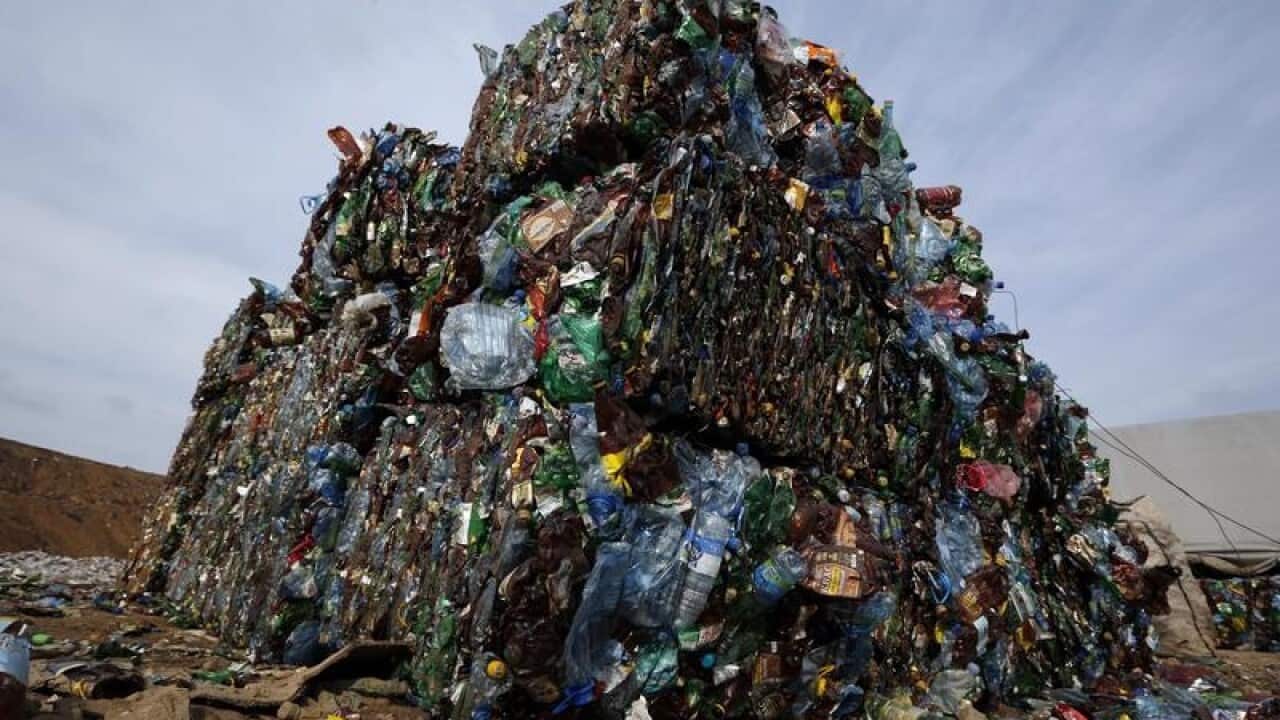 Plastic trash is compacted into bales