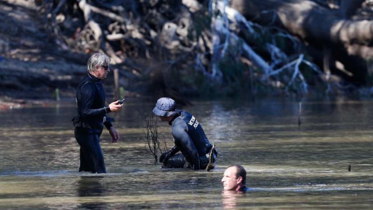 Victorian Emergency services personnel search the Murray River at Moana, Victoria, Friday, Mar. 3, 2017.