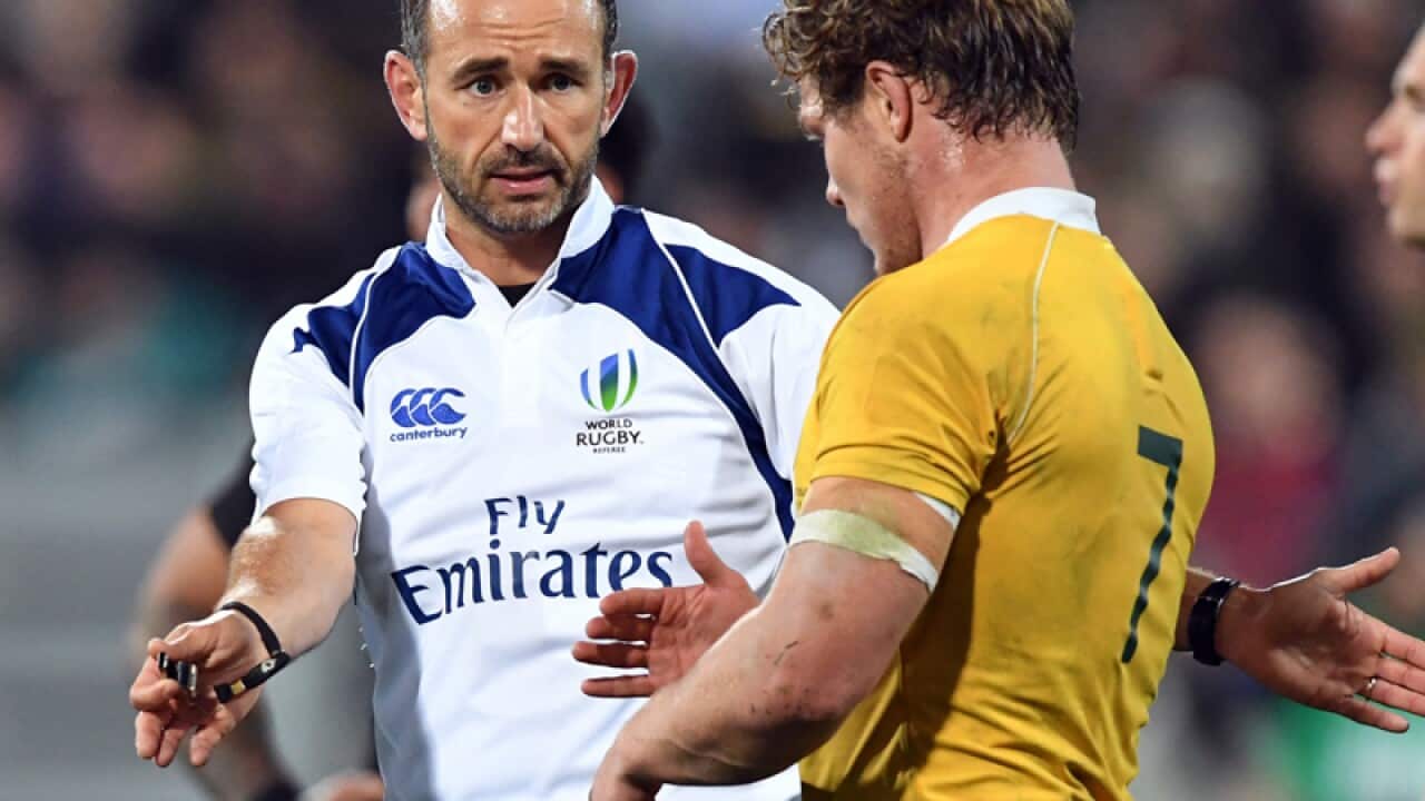 Referee Romain Poite warns David Pocock of Australia