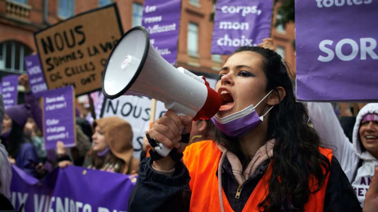 A young woman during a march in Toulouse, France against sexual violence and the patriarchy.
