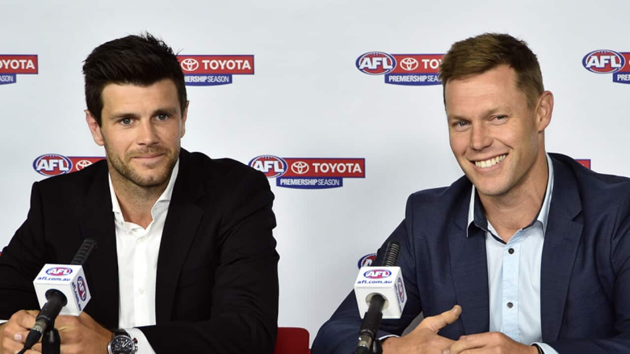 Trent Cotchin (left) and Sam Mitchell in Melbourne