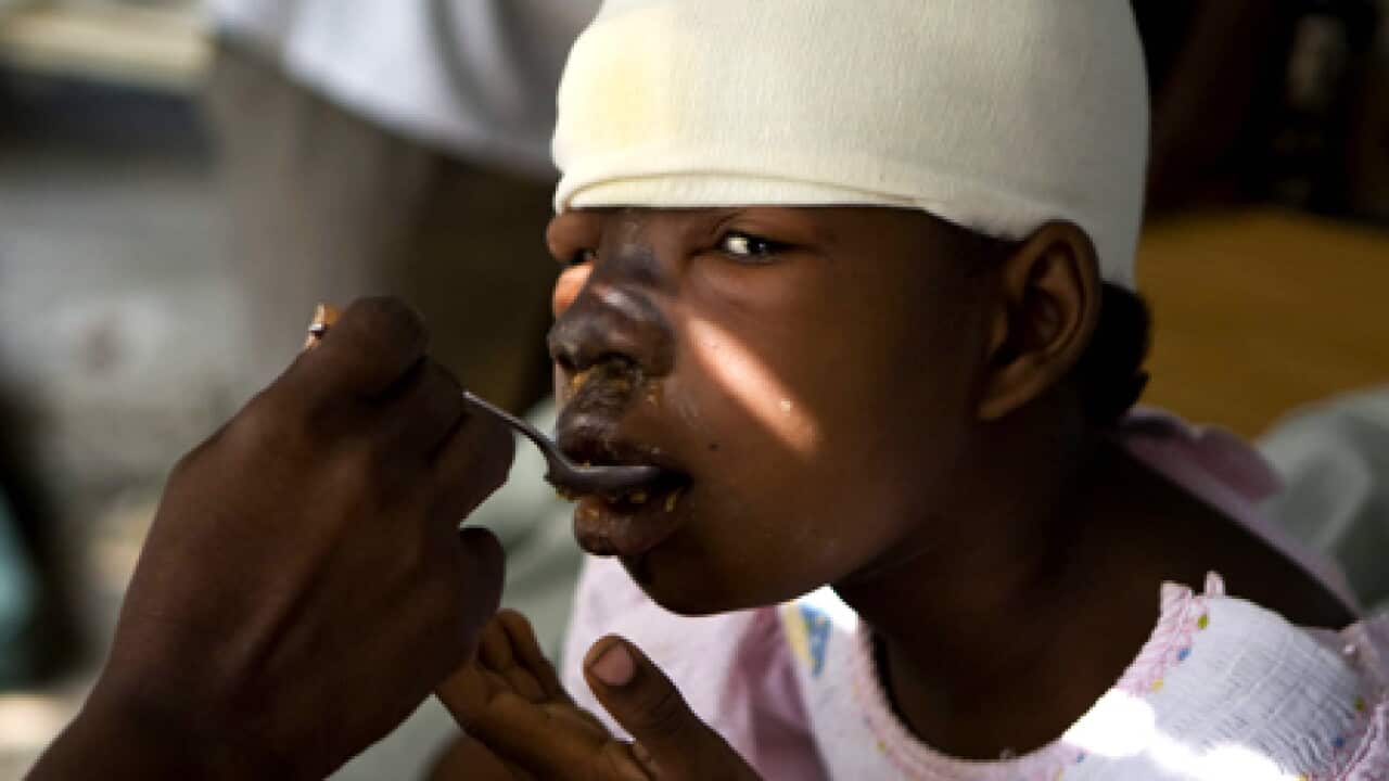 haiti_girl_eating_100118_B_epa_1037824324