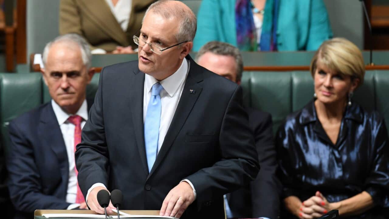 Federal Treasurer Scott Morrison hands down his third Federal Budget in the House of Representatives at Parliament House in Canberra, Tuesday, May 8, 2018. (AAP Image/Dean Lewins) NO ARCHIVING