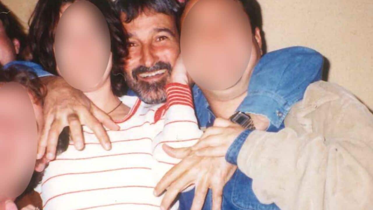 Don Burke with colleagues in 1997