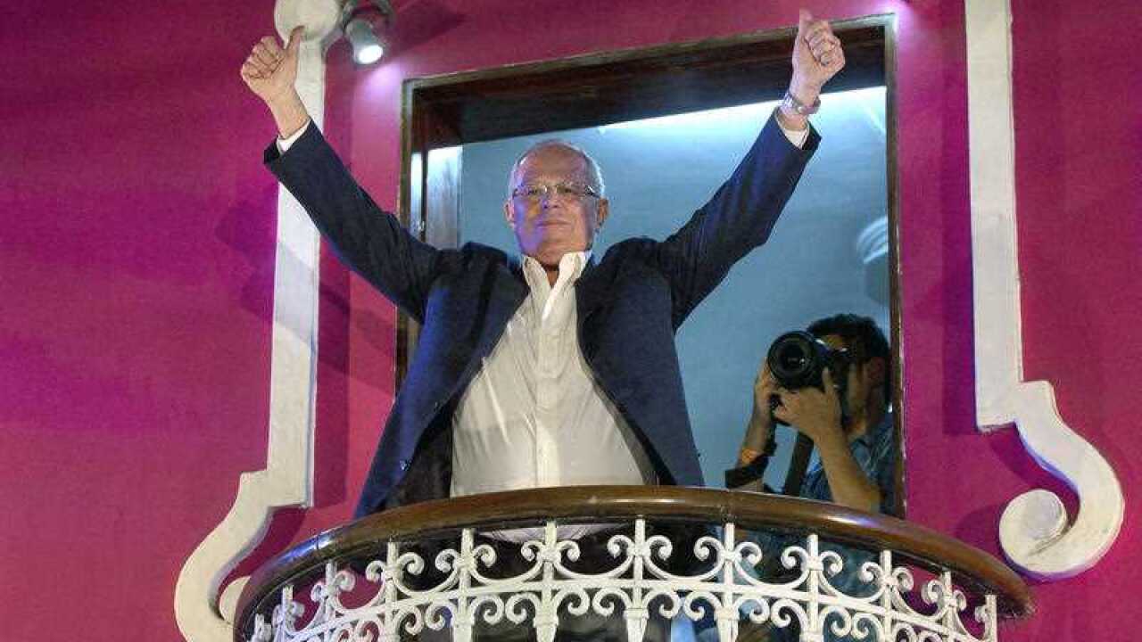 Pedro Pablo Kuczynski greets supporters in Lima, Peru, Sunday, June 5, 2016.