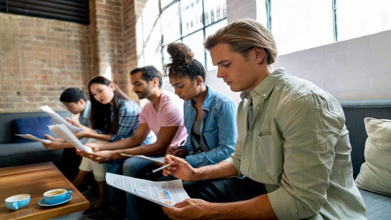 People at the office waiting for a job interview