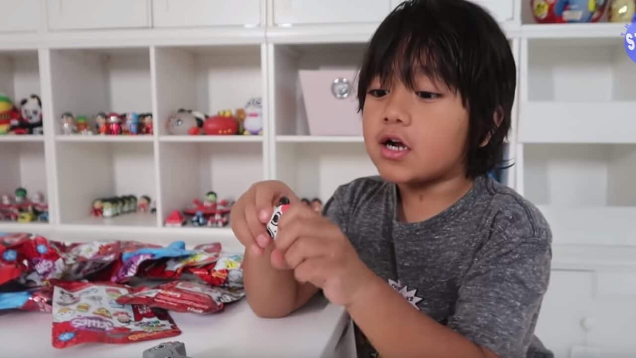 Ryan tries out a new toy.