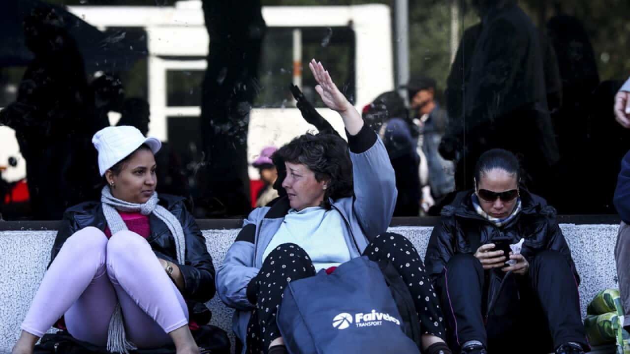 Cuban citizens wait for their mates
