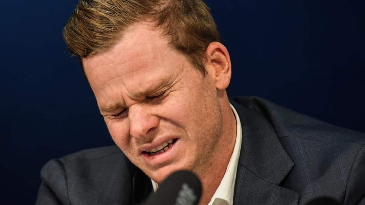 Former Australian captain Steve Smith reacts during a press conference