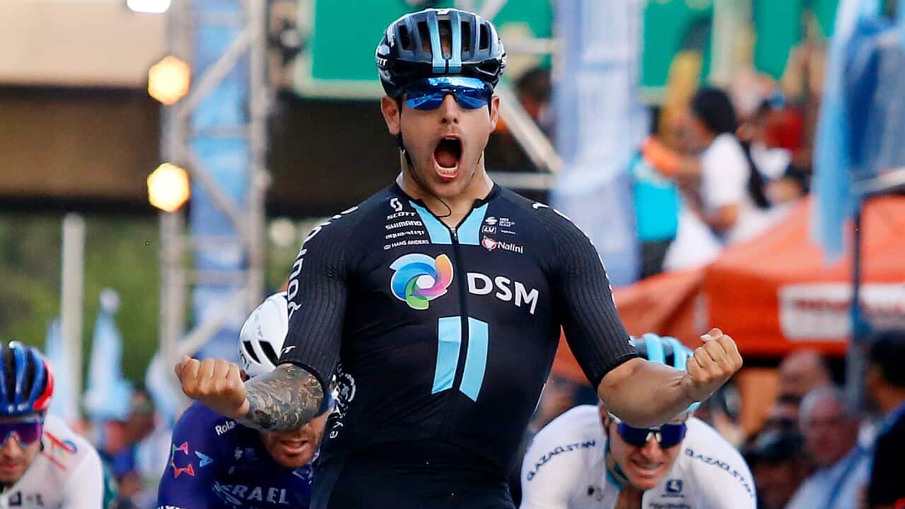 Sam Welsford celebrates a stage victory for Team DSM-Firmenich.jpg