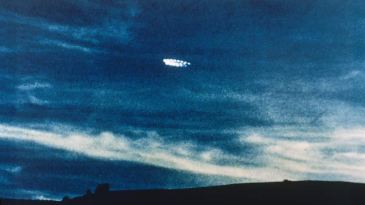 UFO comprising a ring of lights, photographed in the evening sky by Fred and Phyll Dickeson of Timaru, New Zealand Date: 27 October 1979