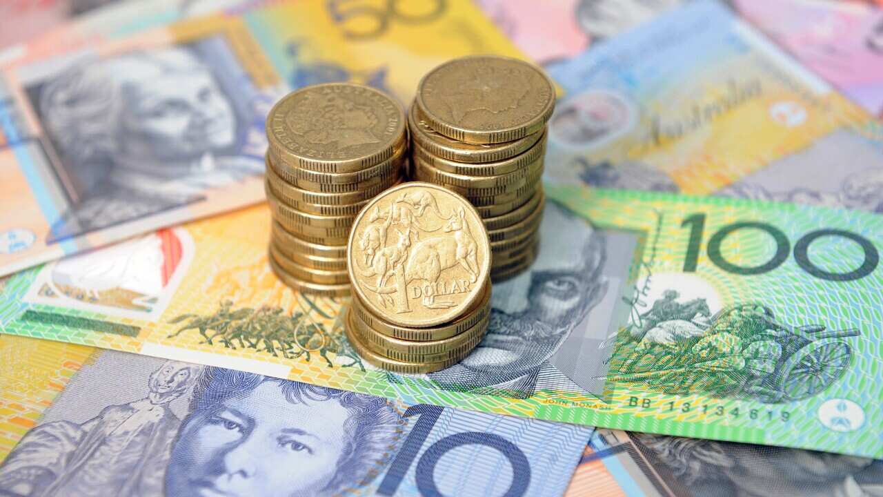 Australian dollars in Sydney, Friday, Jan. 15, 2016. (AAP Image/Joel Carrett) NO ARCHIVING