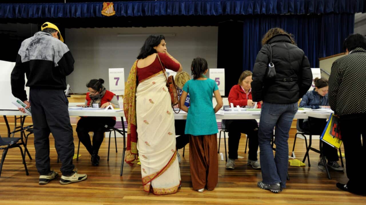 Voters que at a polling booth at West Epping Public School in the electorate of Bennelong in Sydney, Saturday, Aug. 21, 2010.