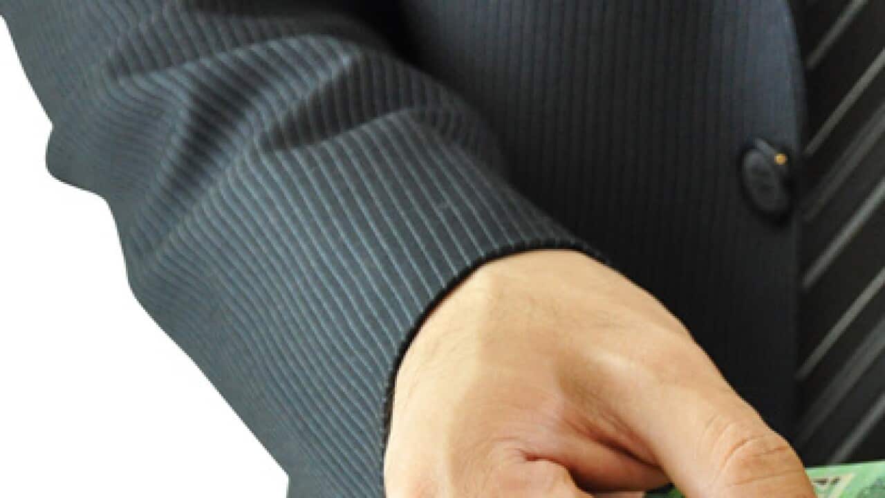 Businessman hands holding money