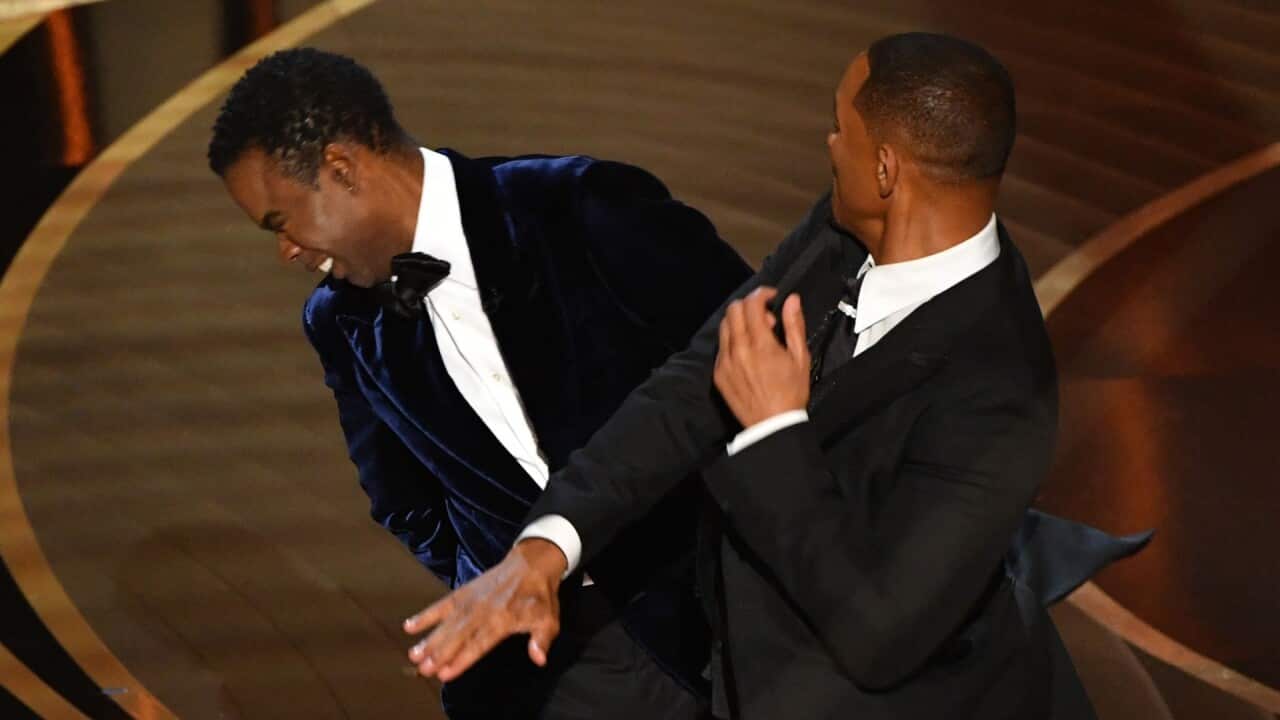 US actor Will Smith (R) slaps US actor Chris Rock onstage during the 94th Oscars at the Dolby Theatre in Hollywood, California on March 27, 2022.