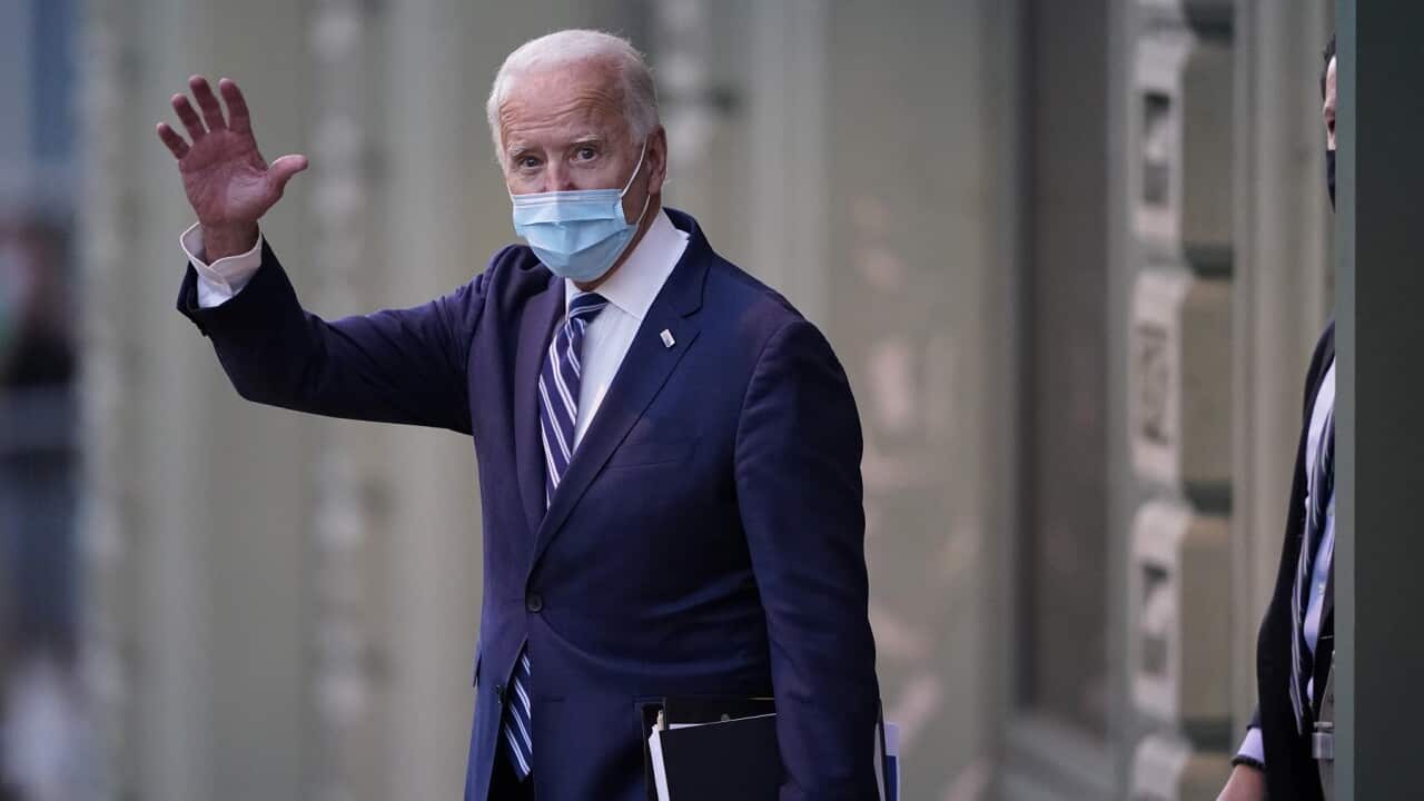 President-elect Joe Biden wavs as he leaves The Queen theater, Tuesday, Nov. 10, 2020, in Wilmington, Del. (AP Photo/Carolyn Kaster)