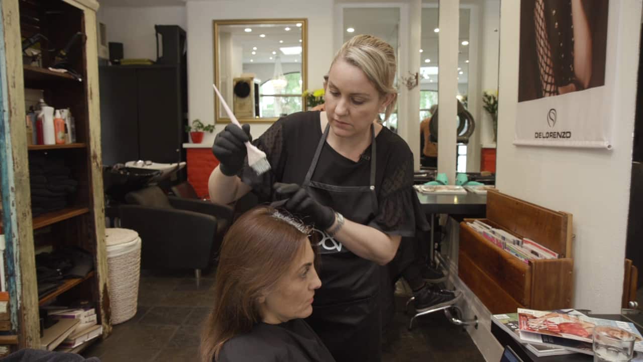 Blondies owner Eliza Showell with a client in her salon