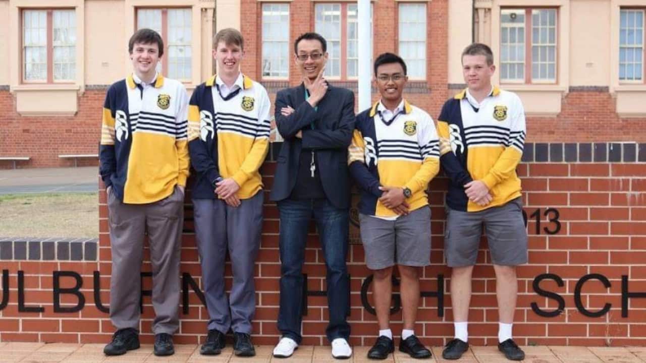 An IT teacher and high school students in NSW