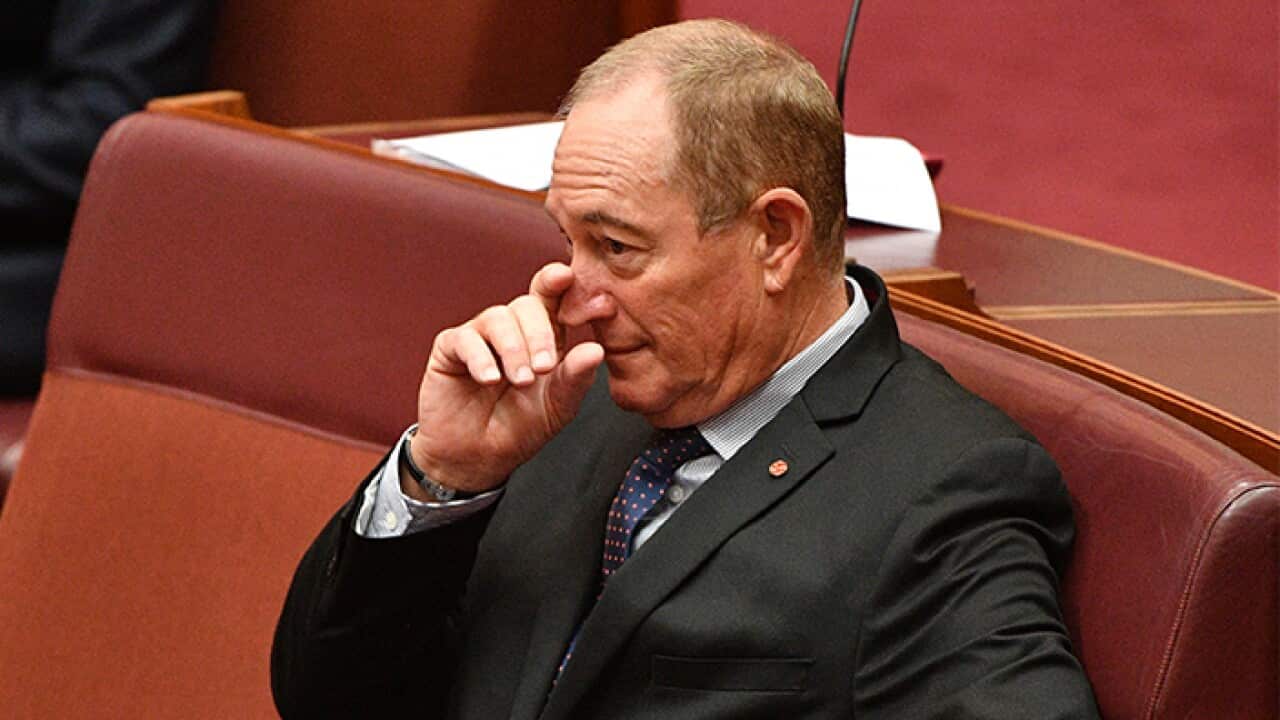 Senator Fraser Anning scratching his nose