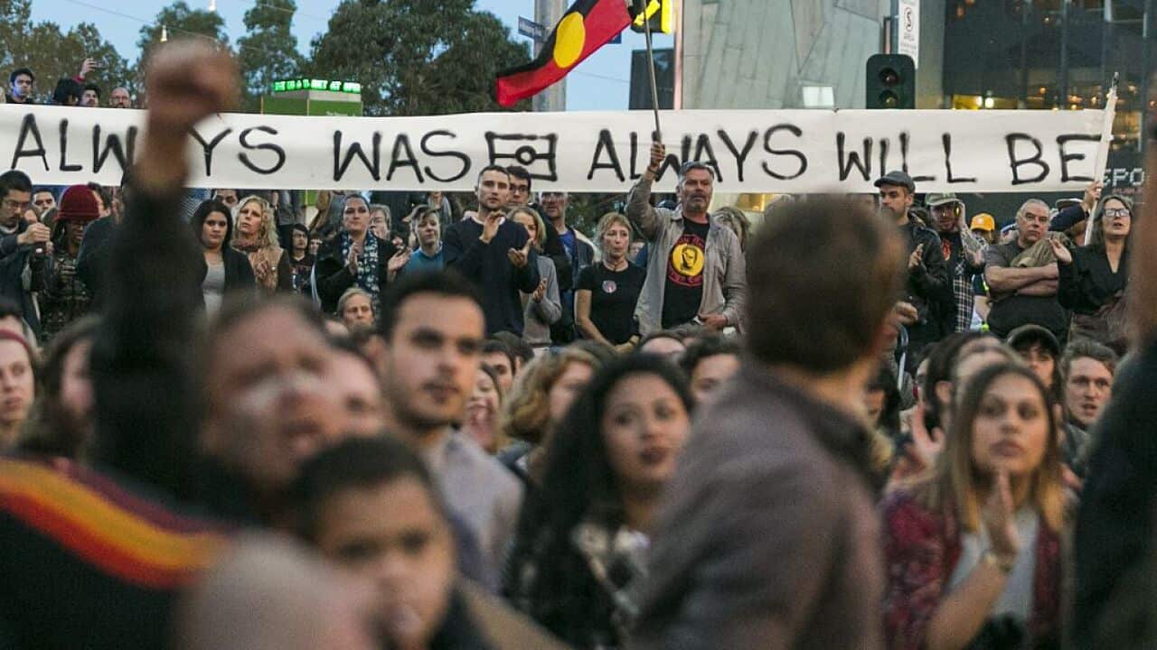 Protestors cheer during a rally protesting against the forced closure of Aboriginal Communities in Melbourne on 1 May 2015.