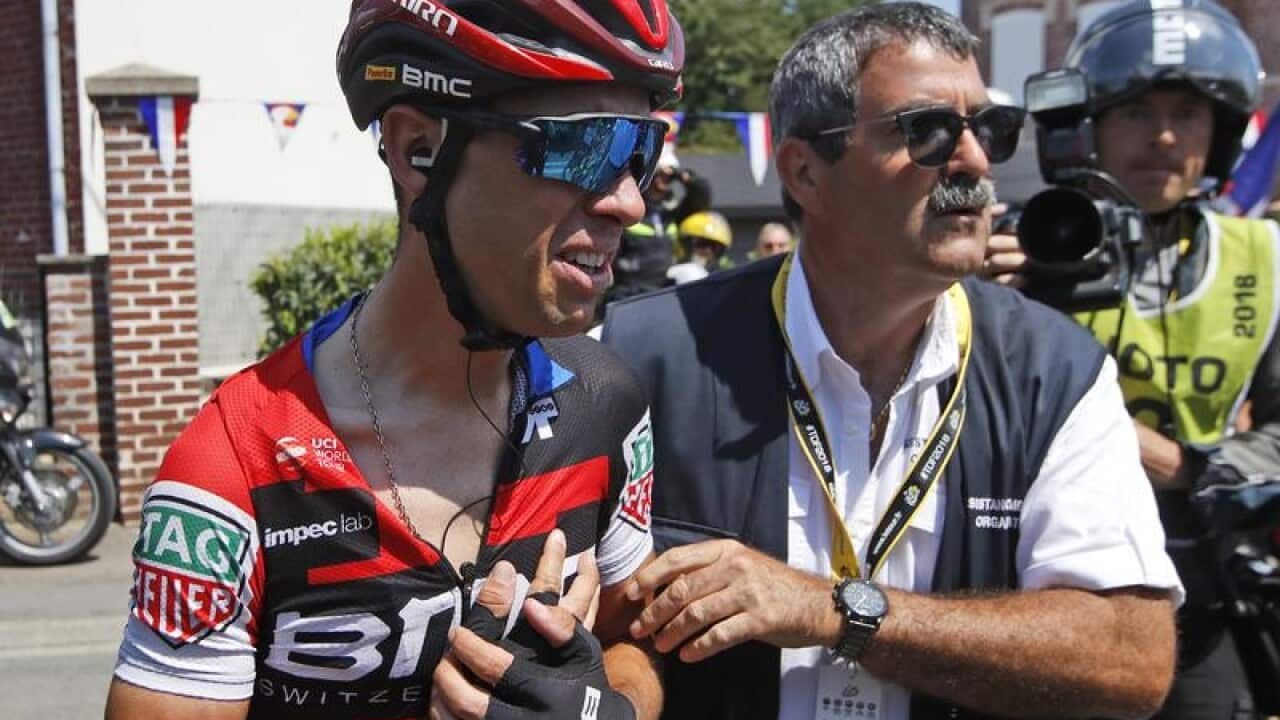 Australian cyclist Richie Porte (L) after sustaining an injury