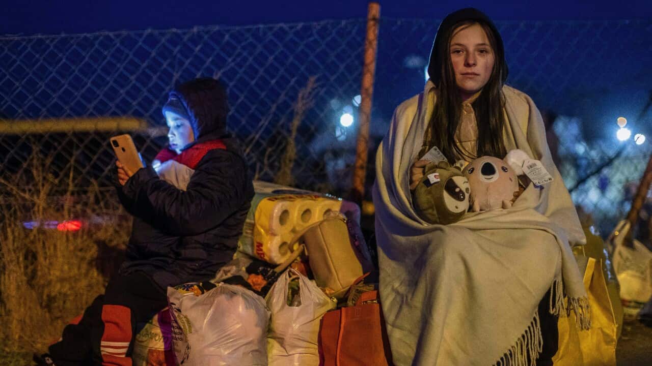 Helena and her brother Bodia from Lviv are seen at the Medyka pedestrian border crossing, in eastern Poland on 26 February.