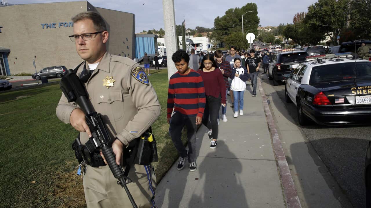 Students are escorted out of Saugus High School after reports of a shooting on Thursday, Nov. 14, 2019, in Santa Clarita, Calif. (AP Photo/Marcio Jose Sanchez)