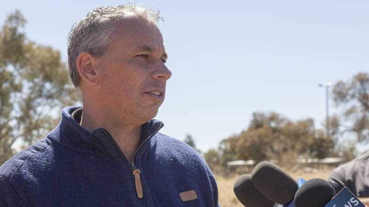 Northern Territory Chief Minister Adam Giles speaks to the media after voting at the Braitling Primary School booth in Alice Springs