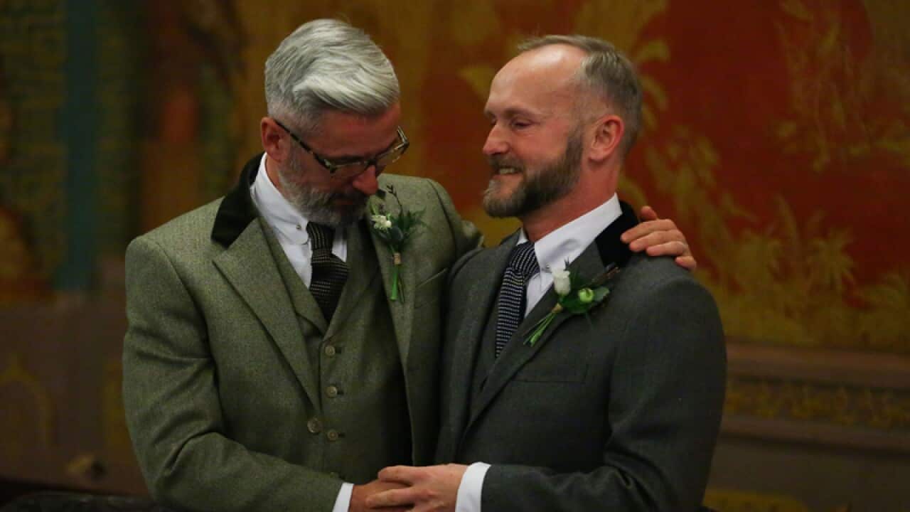 Andrew Wale (L) and Neil Allard during their wedding service, Brighton