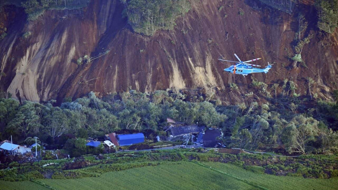 An aerial photo shows landslides that seem to be happened by the earthquake in Atsuma Town, Hokkaido on Sep.6, 2018.