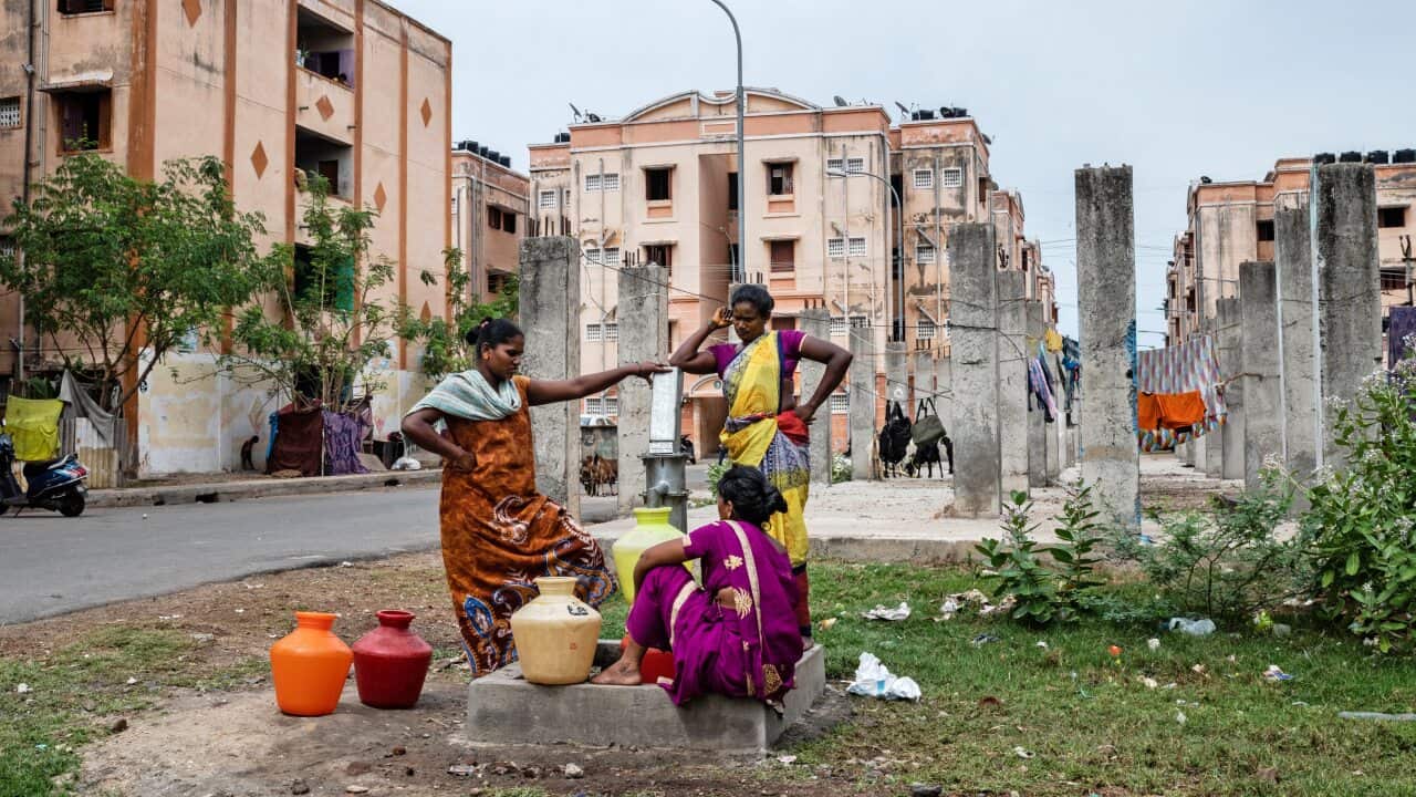 Residents use a hand-pump to collect water at an apartment complex whose buildings are not connected to a central water supply in the OMR district of Chennai, India.