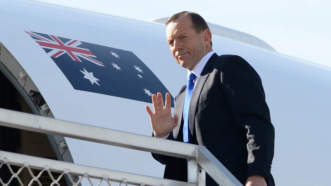 PM Tony Abbott boards a RAAF jet as he departs for Indonesia on his first overseas trip as Prime Minister in Sydney - AAP-1.jpg