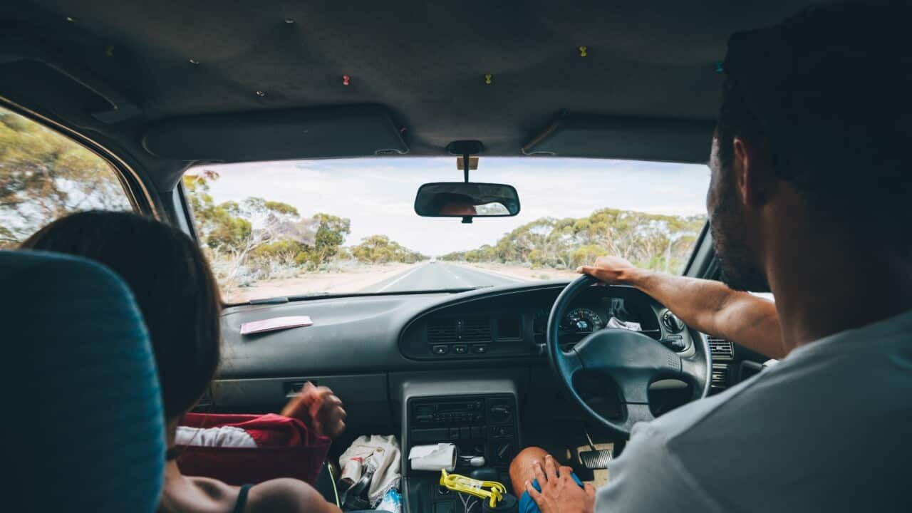 Young man sitting in a car