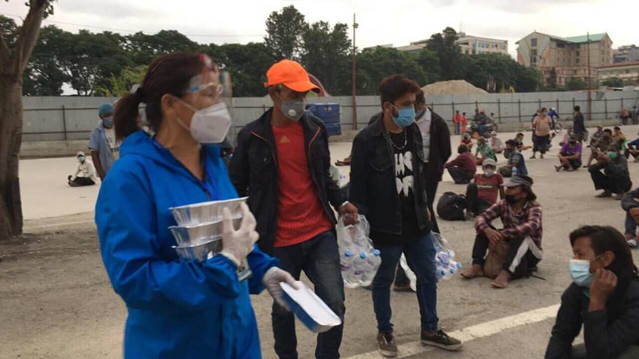 social activist distributing food for the needy