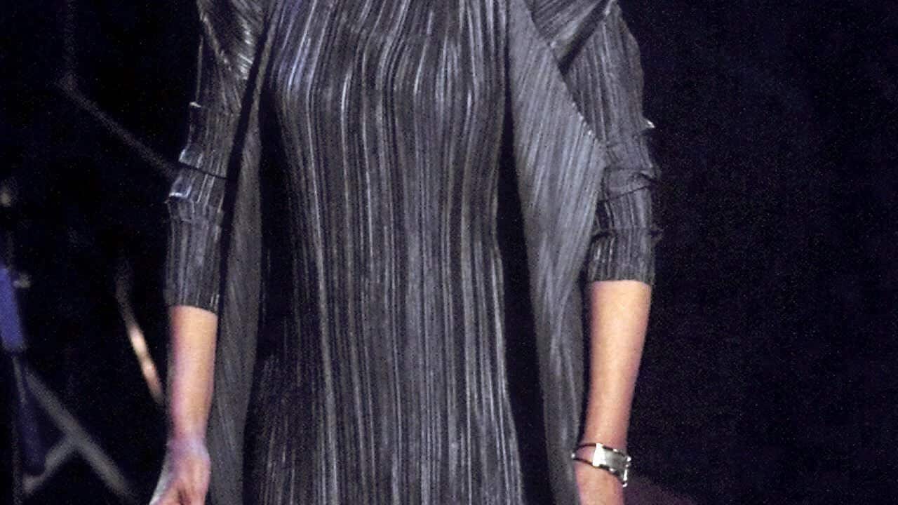 Singer-songwriter Joni Mitchell smiles as she takes the stage in New York City in this April 6, 2000, file photo. (AP Photo/Suzanne Plunkett)