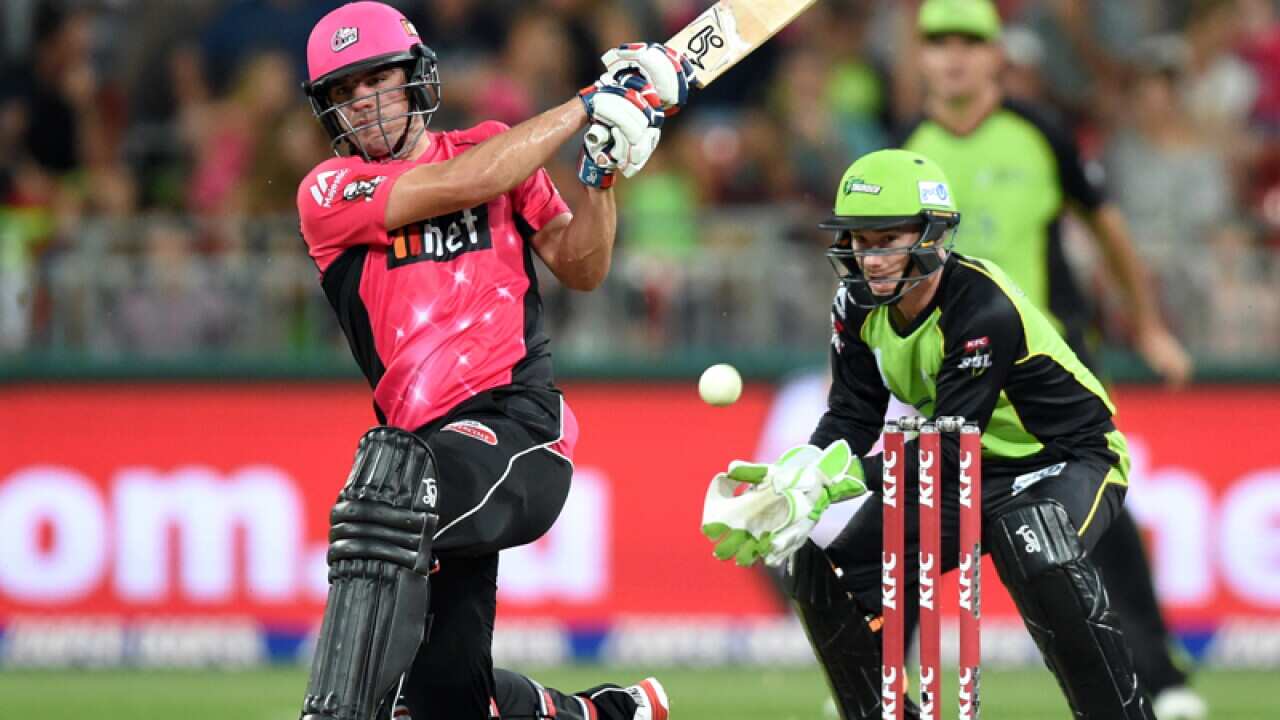 Moises Henriques (L) of the Sixers hits a shot
