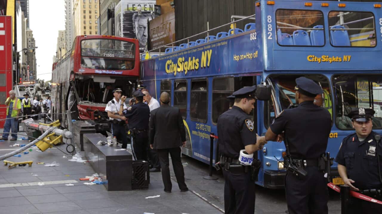 Two double-decker tourist buses are seen crashed into each other
