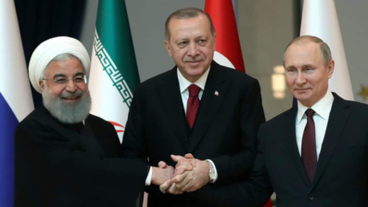 Iran's President Hassan Rouhani, left, Turkey's President Recep Tayyip Erdogan, centre, and Russia's President Vladimir Putin