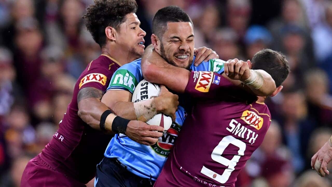 Adelaide will host a State of Origin game in 2020. Jarryd Hayne of the Blues tackled by Dane Gagai (left) and Cameron Smith (right) of the Maroons.