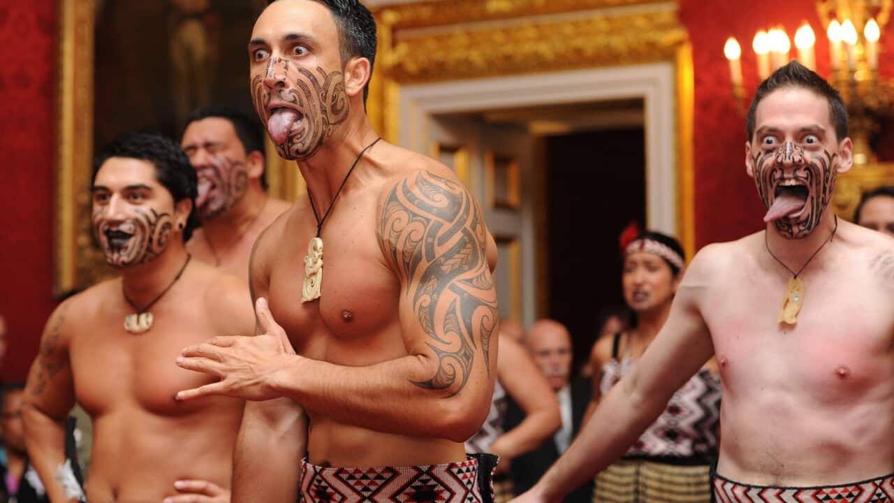 Dancers perform the Haka, a traditional Maori dance.