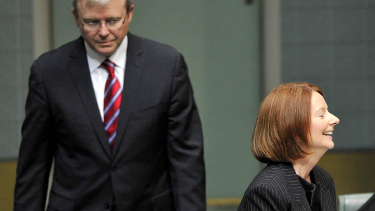 Kevin Rudd walking behind his then-deputy PM Julia Gillard