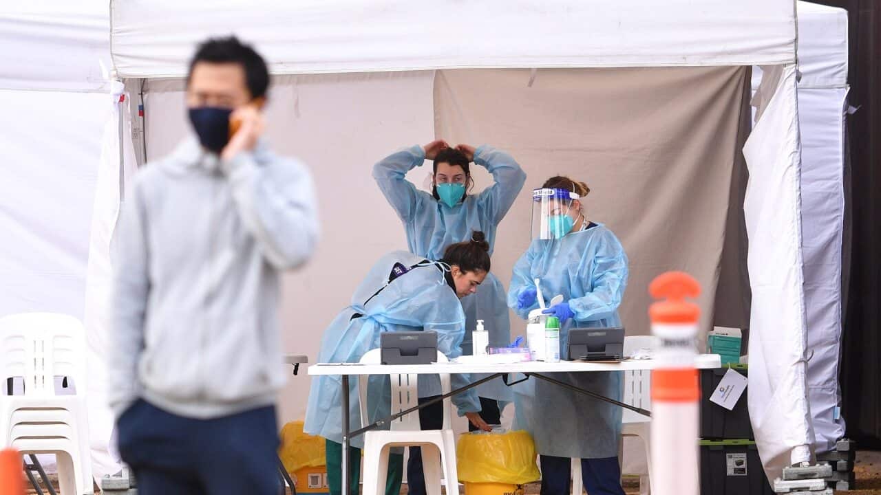 Healthcare workers at a pop up COVID-19 testing facility outside of the Australian Centre for Contemporary Art complex in Melbourne.