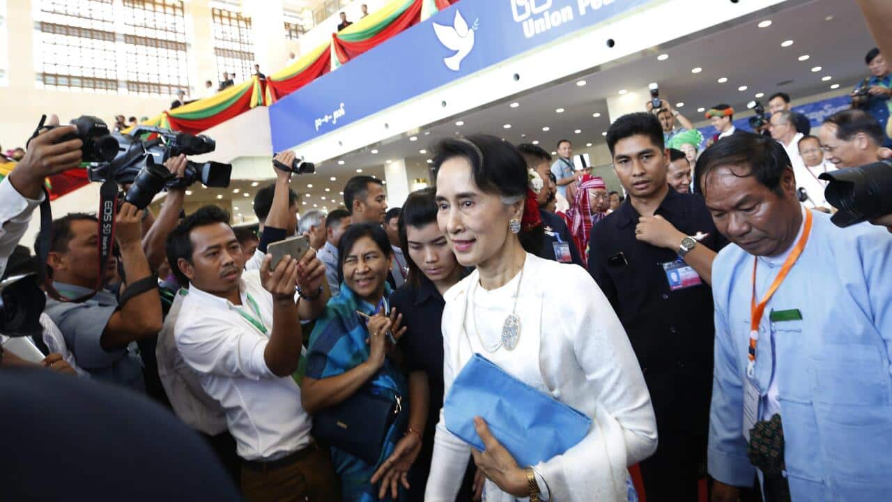 Aung San Suu Kyi leaves peace conference in Myanmar - EPA
