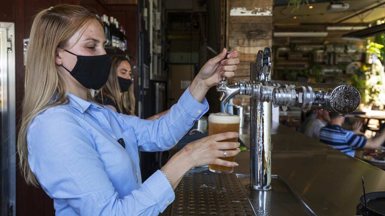 Bar staff in Prahran, Melbourne, in October 2020.