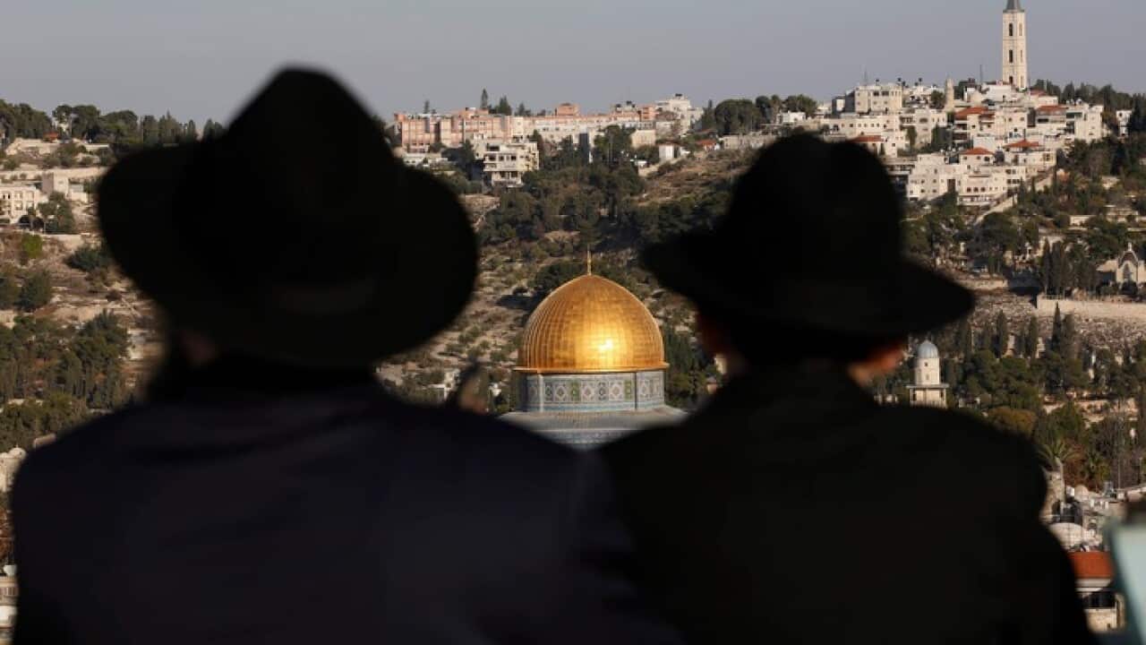 Ultra Orthodox Jews look towards the Haram el-Sherif (Noble Sanctuary), or The Temple Mount to Jews, in the Old City of Jerusalem