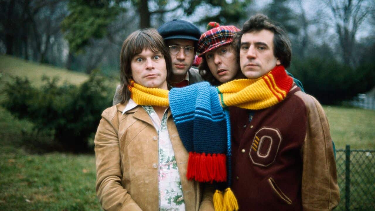 Monty Python Comedians Sharing a Scarf