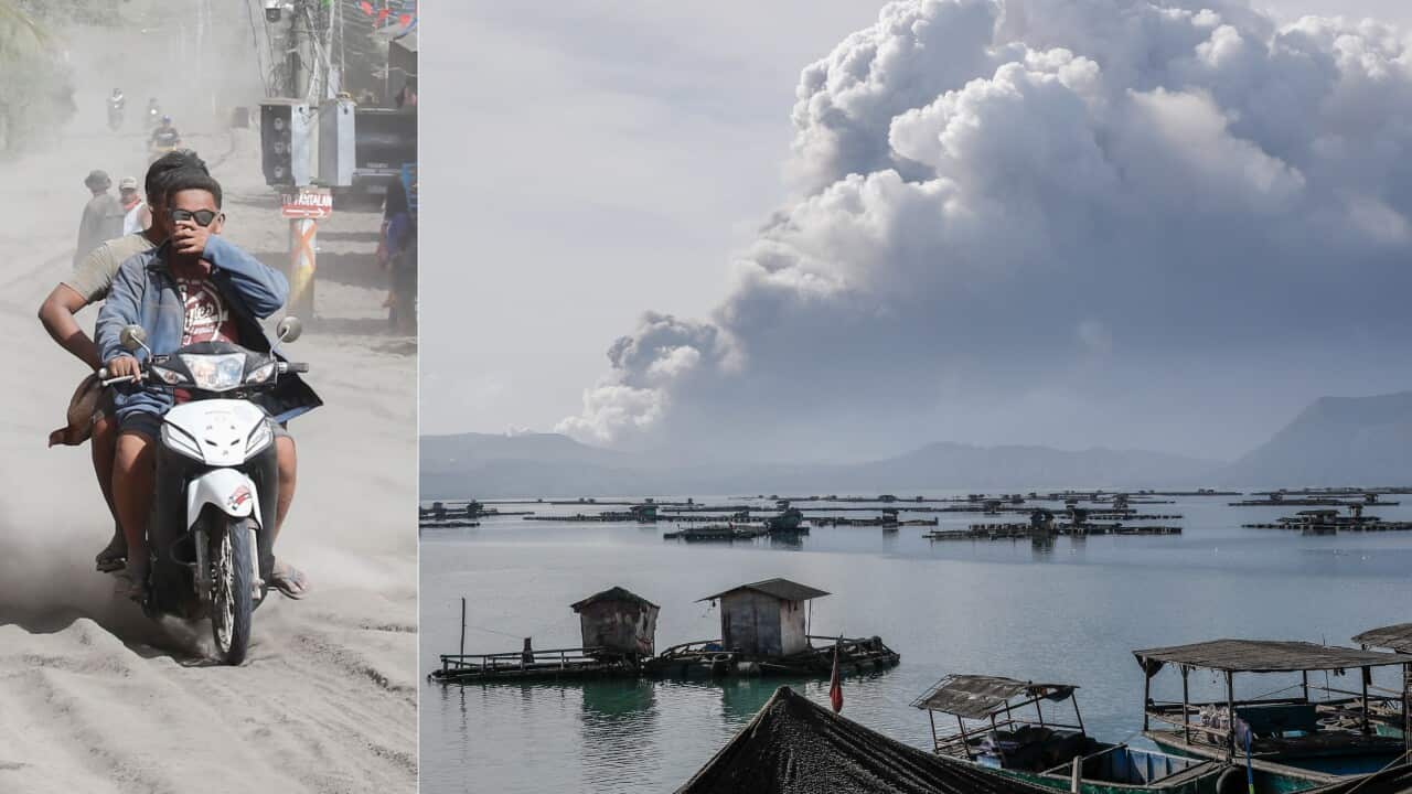 Motorists travel along a road covered in ash deposits, a day after the eruption of Taal Volcano, in Agoncillo town in Batangas province, Philippines.