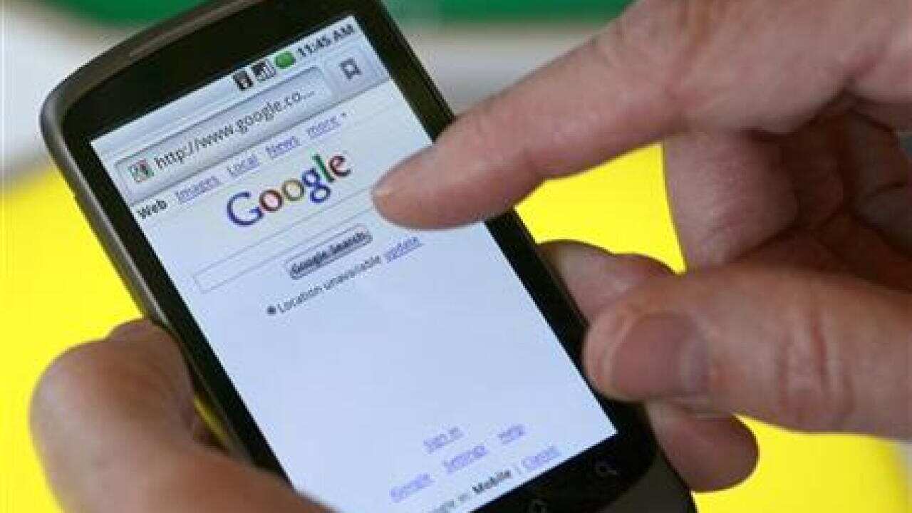 A model demonstrates a Nexus One smartphone, the first mobile phone Google will sell directly to consumers, after a news conference in Mountain View