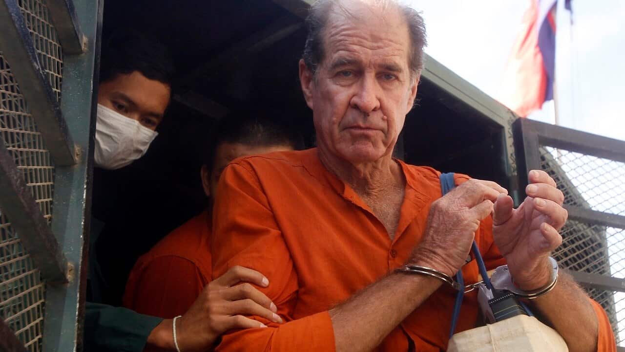 Australian filmmaker James Ricketson arrives at Phnom Penh Municipal Court.